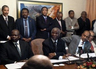 Pagan Amum (left), chief negotiator from South Sudan, lead mediator for the African Union, Thabo Mbeki (centre) and Sudan’s head negotiator Idriss Abdu Qadir , attend  African Union-led talks between Sudan and South Sudan in Addis Ababa on March 13, 2012. (Getty)
