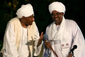 FILE - Sudanese former Prime Minister and leader of the National Umma Party (NUP) al-Sadiq al-Mahdi (L) and president Omer Hassan al-Bashir
