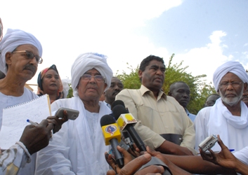 NCF chairman Farouk Abu Issa speaks to reporters as Hassan Al-Turabi PCP leader (L) listens on 12 June 2012 (ST)