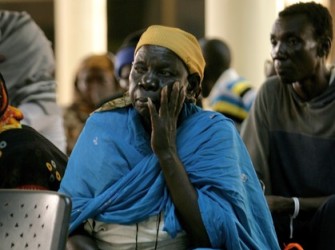 A Southern Sudanese woman sits waiting in the departure lounge of Khartoum's International airport on June 6, 2012 (Getty)