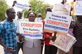 Citizens hold placards in support of President Kiir during the civil society protest in Juba on Monday, June 11, 2012 (Photo Larco Lomoyat)