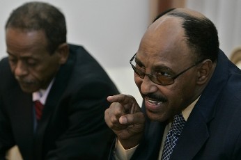 Sudan's defense minister Abdel Rahim Hussein (L).