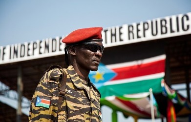 A member of the SPLA stands guard during celebrations to mark the first anniversary of South Sudan's independence in Juba, July 9, 2012 (Reuters)