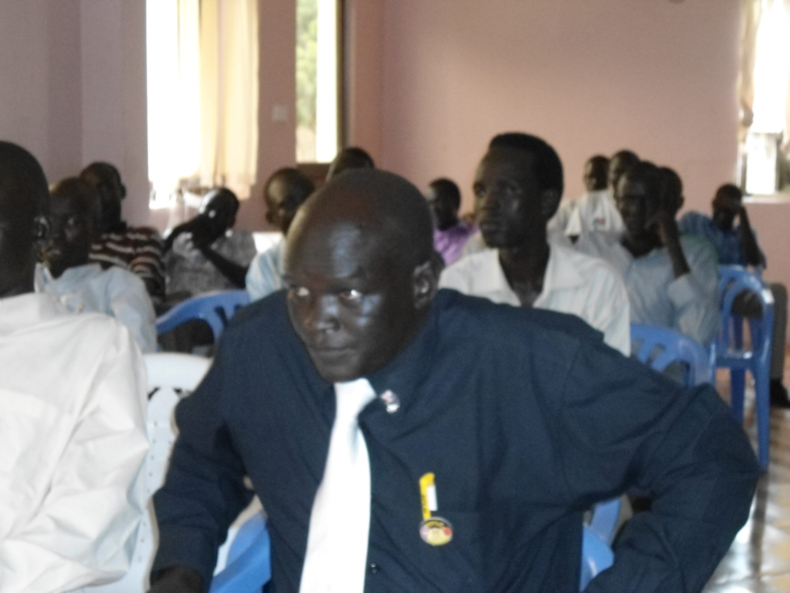 SPLM-DC Chairperson in Jonglei State, Tut Chot, gets up to address the new members of South Sudan's largest opposition party, 21 July 2012 (ST)