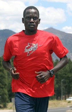 Guor Marial, 28, runs along a street in Flagstaff, Arizona July 21, 2012. The marathon runner born in what is now South Sudan will be allowed to run under the Olympic flag in London, (Reuters