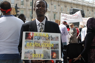Sudan protester outside Downing Street, London, UK, June 30, 2012 (ST)