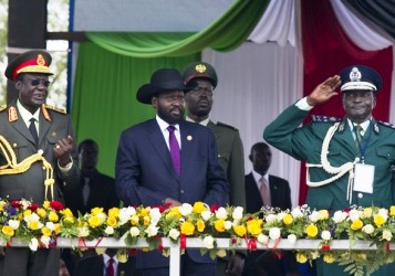 South Sudan President, Salva Kiir (C) watches alongside top military officials as a military parade marches past during a ceremony celebrating the anniversary of South Sudan's first Independence day on July 9, 2012 (Getty)