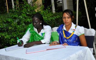 Martha Nyaliet Chol, South Sudan Manager for KCB Diaspora banking (L) with another staff member, July 16, 2012 (ST)