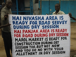 Residents carry banners in Bor July 27, 2012 (ST)