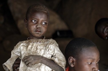 A girl and her brother sit in a cave shelter in Tess village in the rebel-held territory of the Nuba Mountains in South Kordofan May 2, 2012. (Reuters)