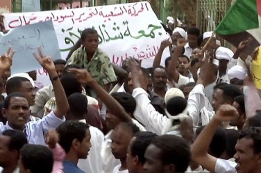 Sudanese demonstrators shouting anti-regime slogans during a protest outside the Wad Nabawi mosque in Khartoum's twin city of Omdurman on July 6, 2012. (Getty)