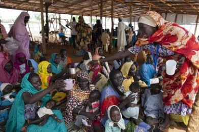 Sudanese mothers gather for a therapeutic feeding for their malnourished babies at the MSF ( Medecins Sans Frontieres ) field hospital July 17, 2012 in Jamam refugee camp, South Sudan. (Getty)