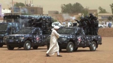 Sudanese police firing teargas at demonstrators (AFP)