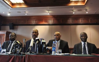 South Sudan’s chief negotiator, Pagan Amum (L) sits alongside Sudan’s Defence Minister Abdel-Rahim Mohamed Hussein (2nd L), Sudanese spokesman Omer Dahab (2nd R) and mediator and former South African President Thabo Mbeki (R) as they announce that both countries have agreed to improve ties and cease hostilities during the latest round of talks in Addis Ababa on July 7, 2012 (Getty)