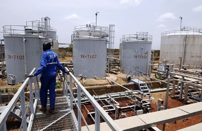 a_worker_walks_at_the_power_plant_of_an_oil_processing_facility_at_an_oilfield_in_unity_state_april_22_2012_reuters.jpg
