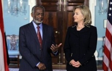 Ali_Ahmed_Karti_L_speaks_as_U-S-_Secretary_of_State_Hillary_Clinton_R_looks_on_as_they_speak_to_the_media_January_26_2011_at_the_State_Department_in_Washington_DC_AFP.jpg