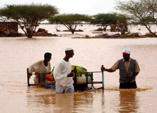 FILE PHOTO - Sudanese men in floods (http://www.redcross.ca)