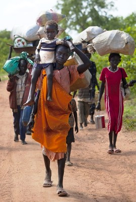 sudanese_refugees_walk_along_the_border_road_after_crossing_from_north_sudan_carrying_what_they_can_on_july_2_2012_in_jaw_south_sudan_-_getty.jpg