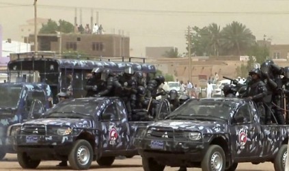 sudanese_riot_policemen_taking.jpg