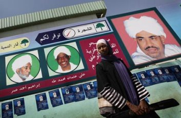 a_sudanese_woman_stands_in_front_of_an_electoral_poster_for_sudan_s_ruling_national_congress_party_the_guardian_website_.jpg