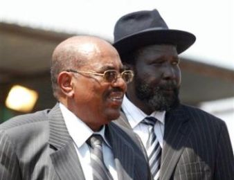 Bashir and Salva Kiir stand in Juba during the second CPA anniversary celebration (Reuters/file)