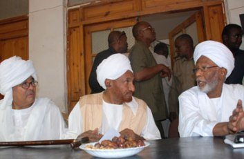 FILE PHOTO - NUP’s leader Al-Sadiq al-Mahdi sitting between the PCP leader Hassan Al-Turabi (R) and Farouq Abu Isa (L) - Al-Jazzera Net