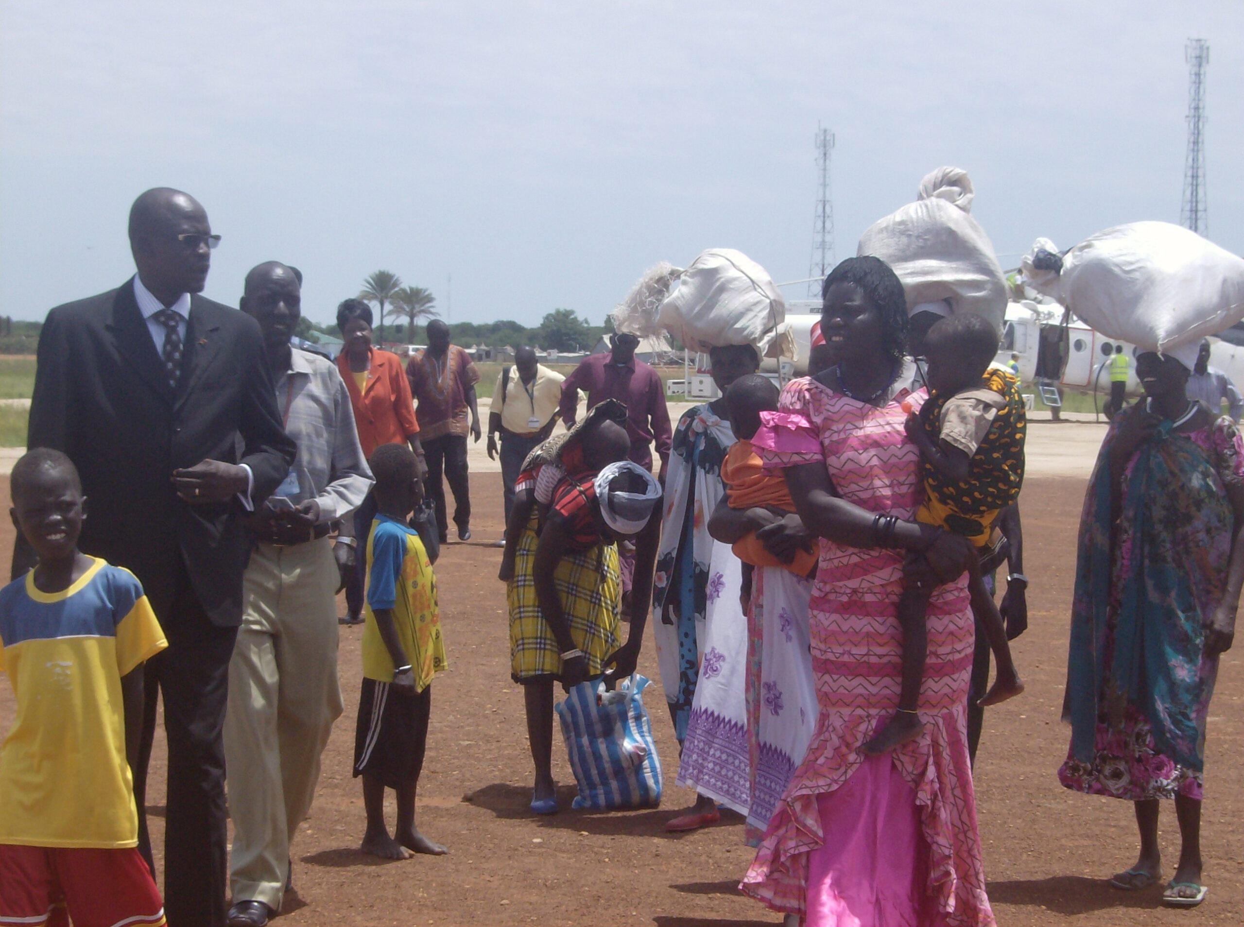 Commissioner of Uror County, Simon H. Duoth with a group of children and women brought from Yuai in Uror County at Bor Airport, September 13, 2012 (ST)