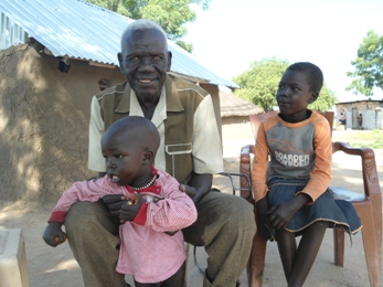 Isaiah Ayuen Deng, September 23, 2012 in Bor at his home with his children (ST)