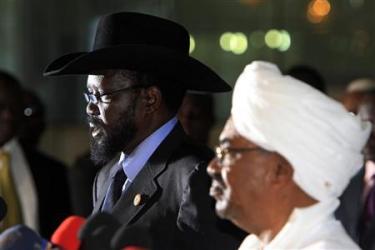 Sudanese President Omar al-Bashir (R) listens as his South Sudanese counterpart Salva Kiir speaks during a joint news conference, at Khartoum Airport October 9, 2011. (Reuters)