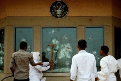 Sudanese protesters try to break into the US embassy in Khartoum during a protest against an amateur film mocking Islam on September 14, 2012. (Getty)