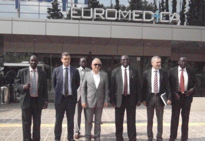 Vice President, Dr. Riek Machar and founder of Axon Group of Companies pose picture in front of one of the Euromedica hospital (ST)