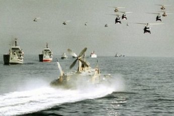 Iranian helicopters and warships take part in maneuvers in the Strait of Hormuz in 2000. (AFP File Photo)
