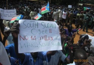 A picture taken on October 4, 2012 shows protesters holding placards against an agreement reached in Addis Ababa about 14 miles (photo by NBGS ministry of information)