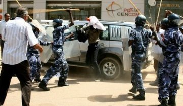 FILE PHOTO - Sudanese police beating a protester during demonstrations in downtown Khartoum in January