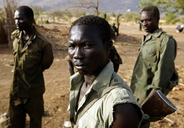 A SPLM-N fighter stands near Gos village in the rebel-held territory of the Nuba Mountains in South Kordofan on 1 May 2012 (Photo: Reuters)