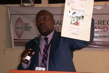 EHAHRD’s Chairperson, Hassan Shire Sheikh displays a copy  of the human rights defenders' handbook, November 10, 2012 (ST)