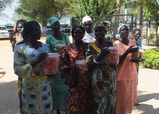 A women's agriculture group in Bor marching to the Jonglei Governor's office with samples of their produce, 19 Nov. 2012 (ST)