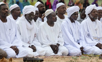 FILE PHOTO - Sudanese Muslims attend morning prayers to celebrate Eid al-Fitr to mark the end of Ramadan, the holiest month on the Islamic calendar, on the outskirts of El Fashir, North Dafur, Aug. 19, 2012. (photo by REUTERS/Albert Gonzalez Farran/UNAMID)
