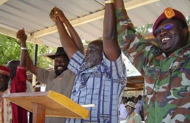 Leaders of SPLM join their hands following successful reconciliation between John Garang and Salva Kiir in Rumbek, Dec. 1, 2004 (ST)