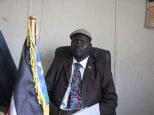 Pochala commissioner Joseph Okello Wello sits outside his office in Pochala town on Feb. 15, 2012 (ST)