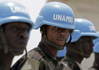 FILE - A handout photo shows Nigerian soldiers serving with the United Nations-African Union Mission in Darfur (UNAMID) stand during an inspection visit by General Martin Luther Agwai, overall commander of UNAMID, to the El Daean Team Group Site in south Darfur March 10, 2008. REUTERS/Stuart Price/Albany Associates/Handout