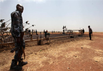 south_sudanese_soldier_by_damaged_oil_well_unity_state_march_3_2012_reuters_-6f5ad.png