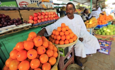 Fruit-seller in the Sudanese capital, Khartoum (Reuters)