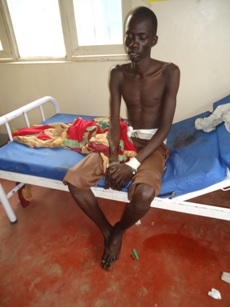 Gatkuoth Juong who was shot in the abdomen during the 6 December attack on Makur village, being treated at Panyajiar County Hospital, Lakes State, South Sudan, 7 December 2012 (ST)