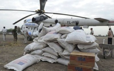 Boxes and sacks of food are unloaded from a U.N. helicopter in Pibor January 12, 2012.(Reuters)