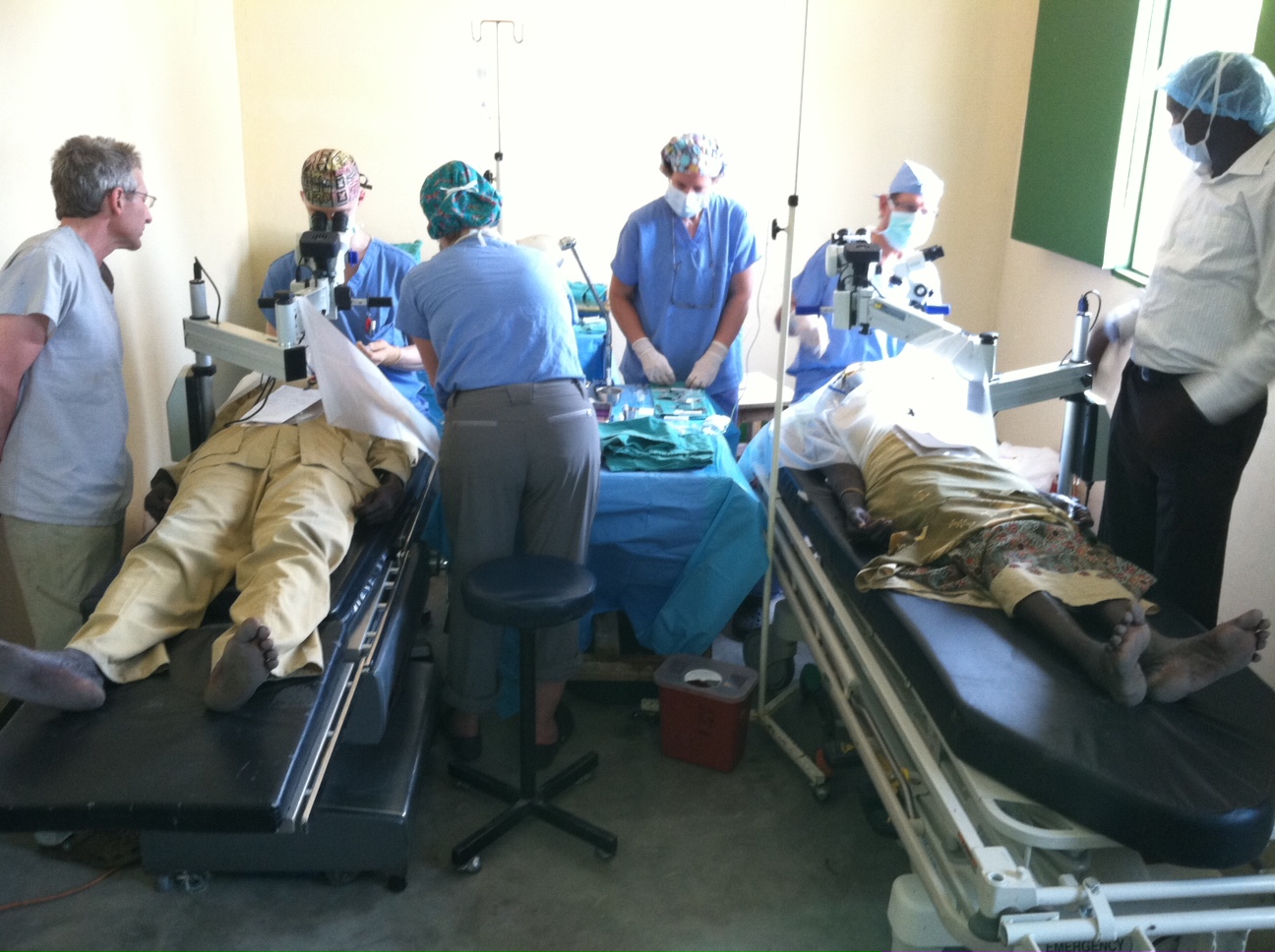 Doctors visiting Duk Lost Boys clinic operate on eye patients in Duk Payuel, Jonglei, December 18, 2012 (John Dau Foundation)