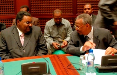 A file photo shows Salah Gosh, former director of Sudanese security and intelligence service talking with Nafie Ali Nafie, presidential assistant in Nov 2007 in Sirte Libya (photo Fred NOY/UNMIS)