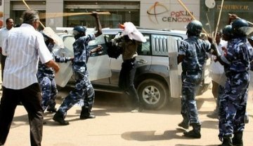 FILE PHOTO - Sudanese police beating protesters
