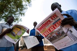 South Sudanese men read newspapers in Juba on 10 July 2011, the day after independence from Sudan (Source: Phil Moore / AFP)