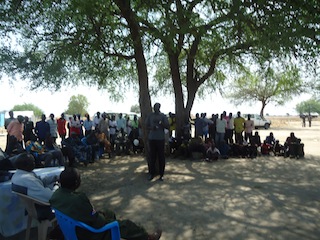 Samuel Ayuen, a youth representative in Jonglei State's Bor County, addresses a gathering attended by Bor Commissioner Agot Alier Leek in Makuach district on Wednesday 2 January 2013 (ST)